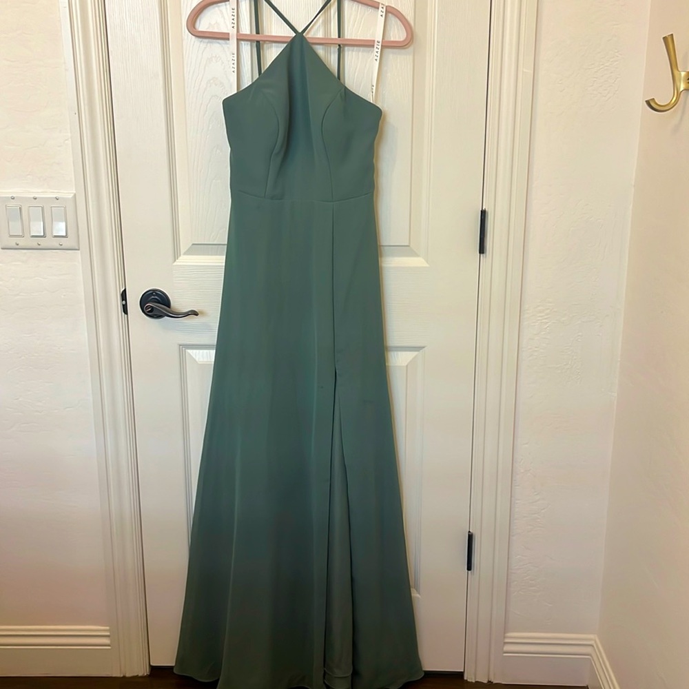 Long green dress with high neck and slit